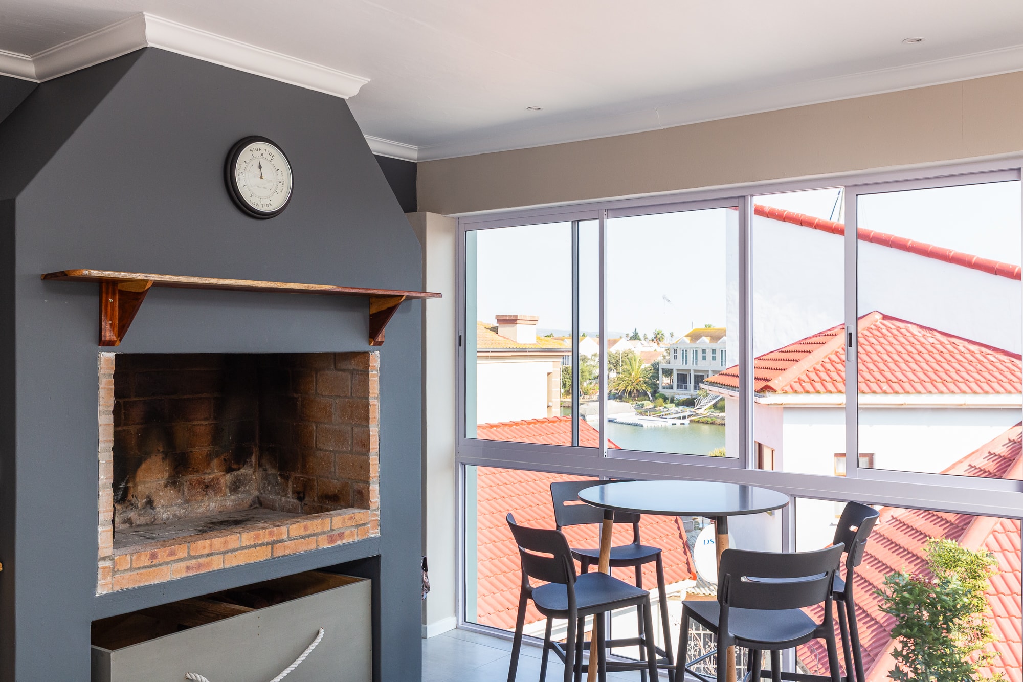 Modern living room with fireplace and waterfront view