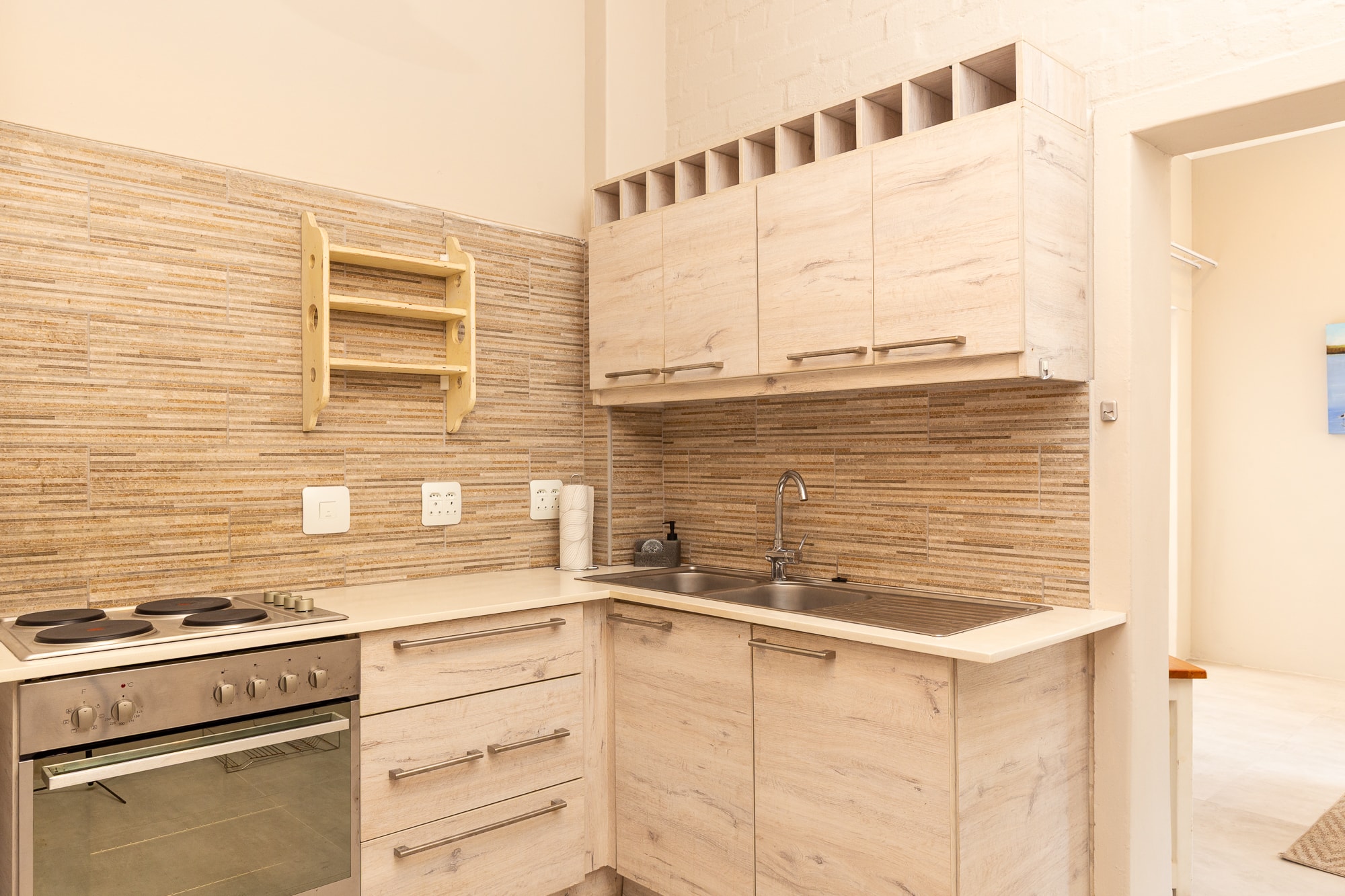 Modern kitchen with light wood cabinetry