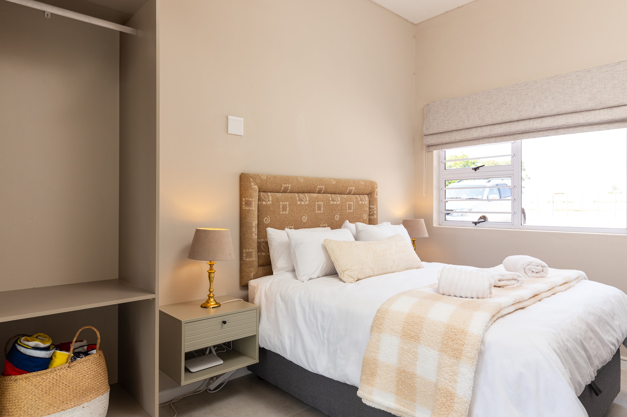 Modern bedroom with neutral tones and window
