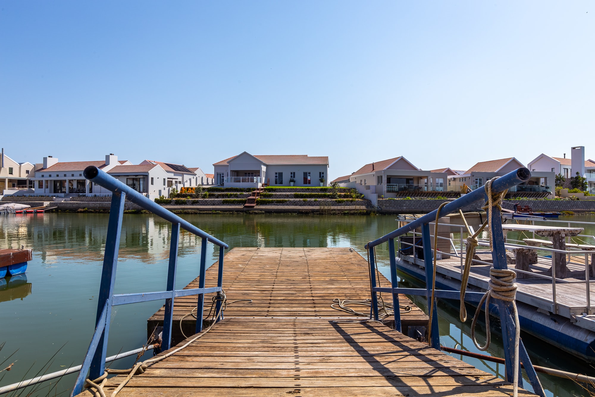 Wooden dock overlooking coastal village waterfront