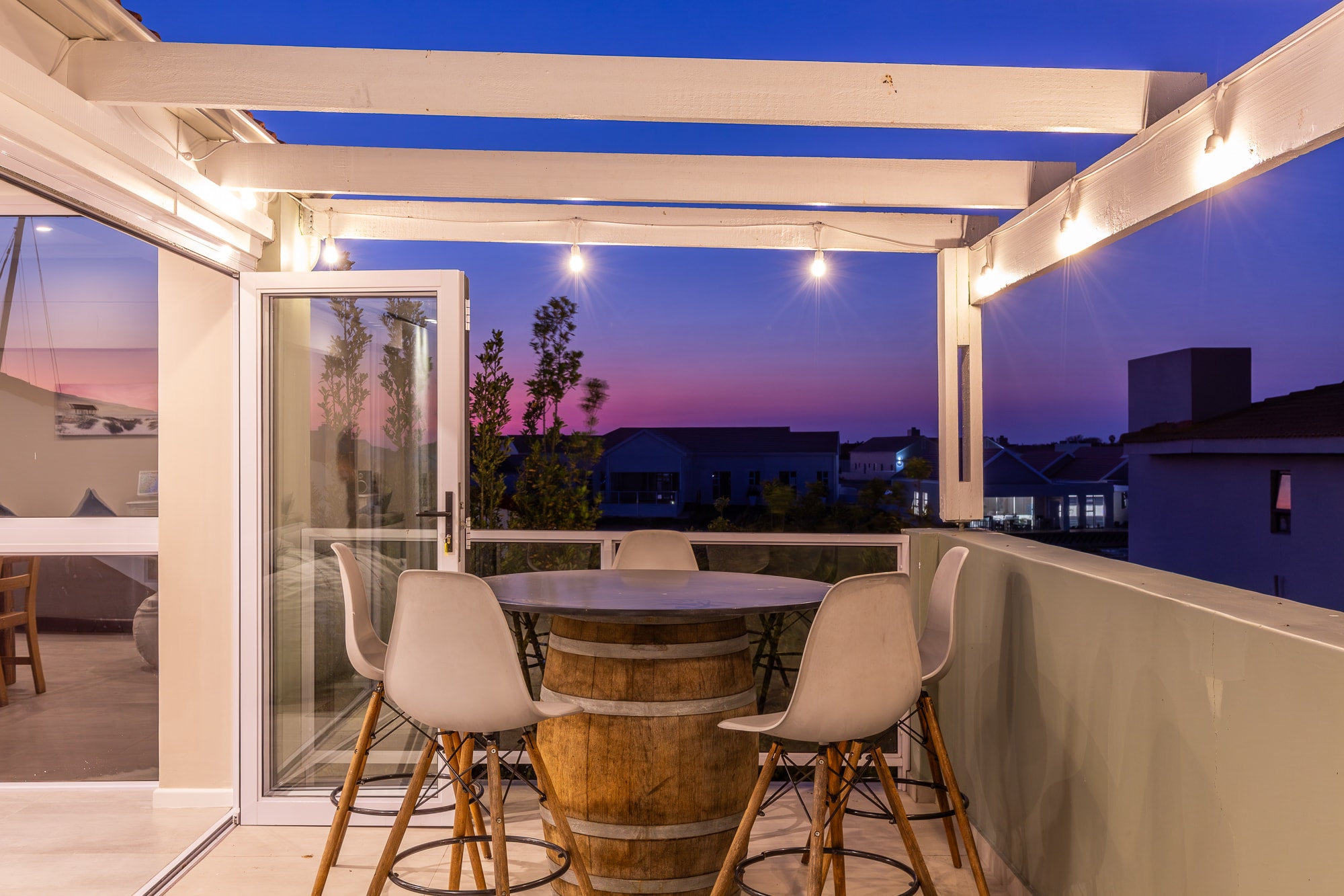 Modern rooftop terrace at twilight